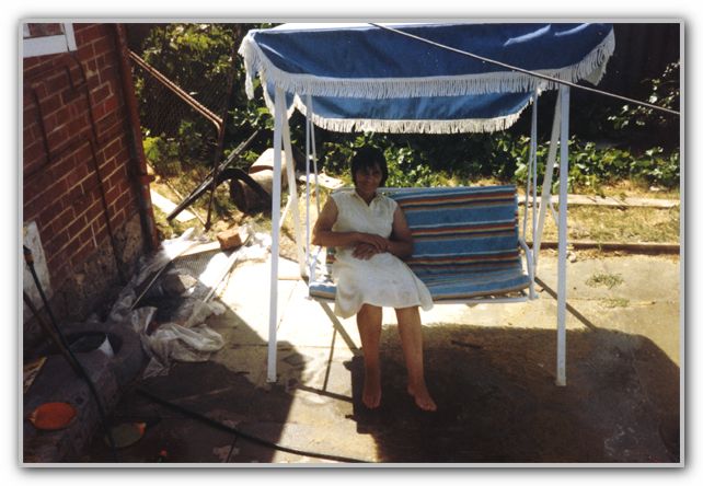 Mum on backyard swing Rosebery St